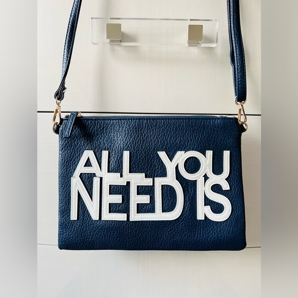 A navy blue shoulder and wristlet, adjustable strap to also wear as a crossbody - Picture 2 of 12